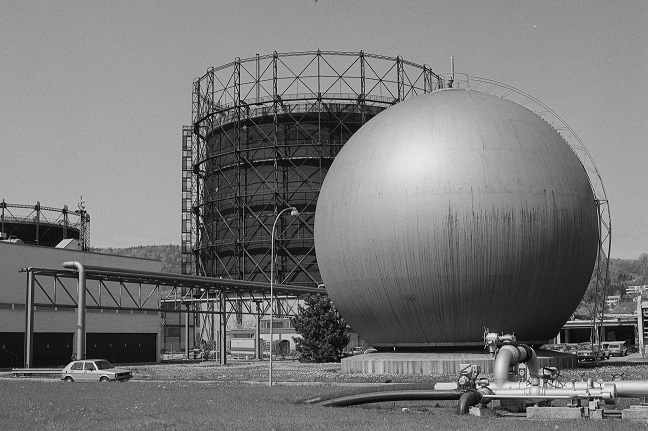 Spherical storage tank and gasometer in the background (Zurich)